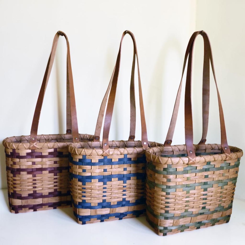 Little Northwoods Tote Basket with a decorative woven pattern and long leather straps